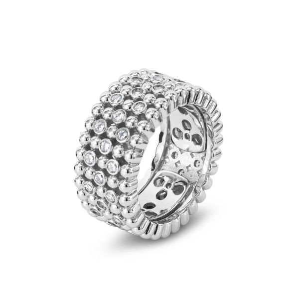 Anello a fascia larga con texture sferica e zirconi incastonati.