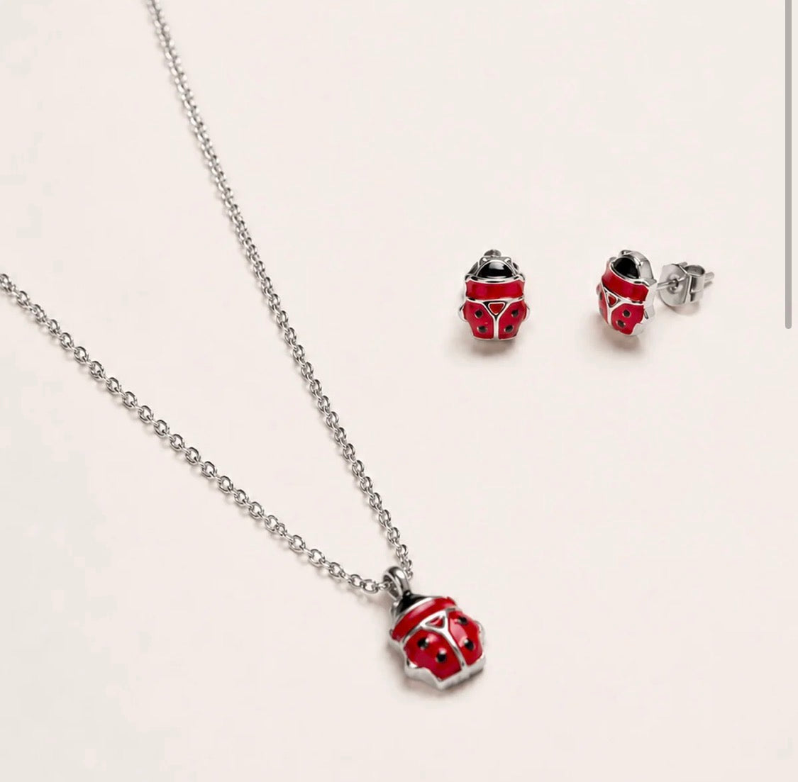PARURE COCCINELLA ROSSA ACCIAIO