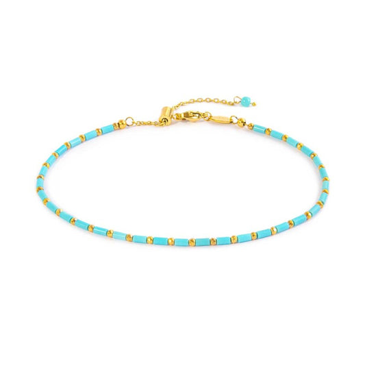 Cavigliera con perline a tubo turchesi ed ematite ( BASE GIALLA )