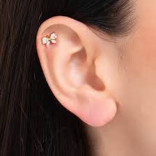 PIERCING ORECCHIO DONNA IN ACCIAIO COLORE ORO FORMA FIOCCO CON ZIRCONI BIANCHI