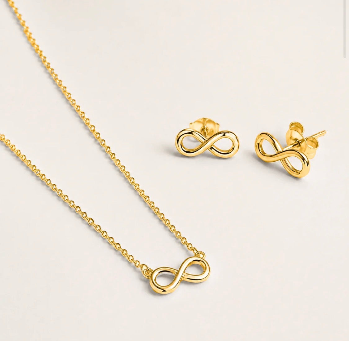 PARURE INFINITO ACCIAIO DORATO
