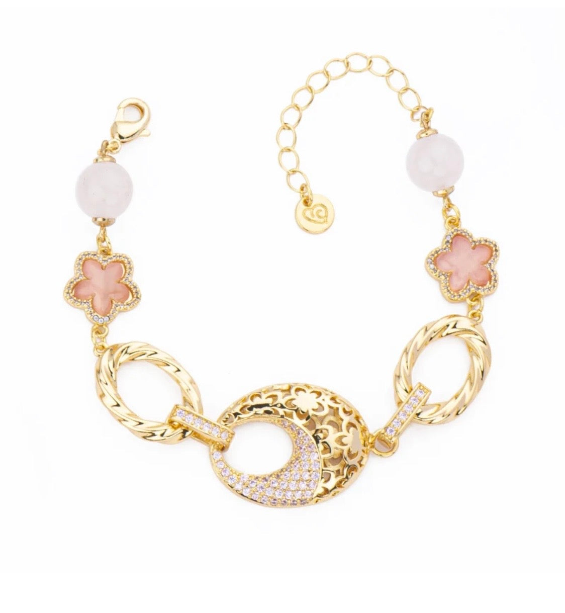 BRACCIALE ELEMENTI CON BASE DORATA ZIRCONI ROSA FIORELLINI E SFERE IN QUARZO ROSA